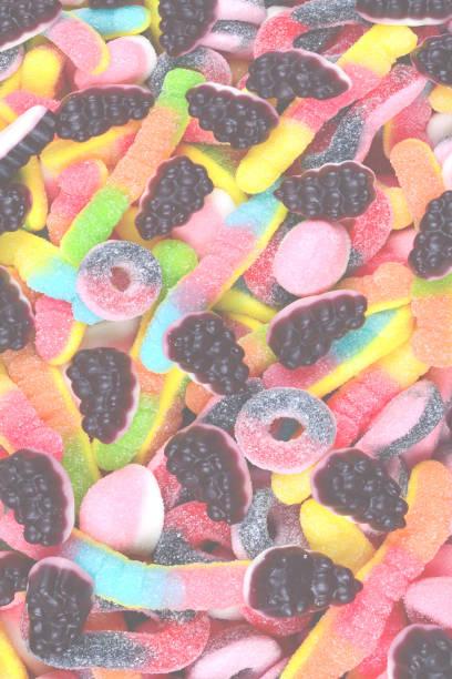 istock Assorted juicy colorful gummy candies. Top view. Candy background. 1418819742