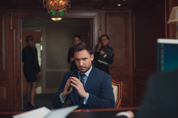 istock Handsome businessman wearing suit in Hotel check in at reception or front office being 1418822120