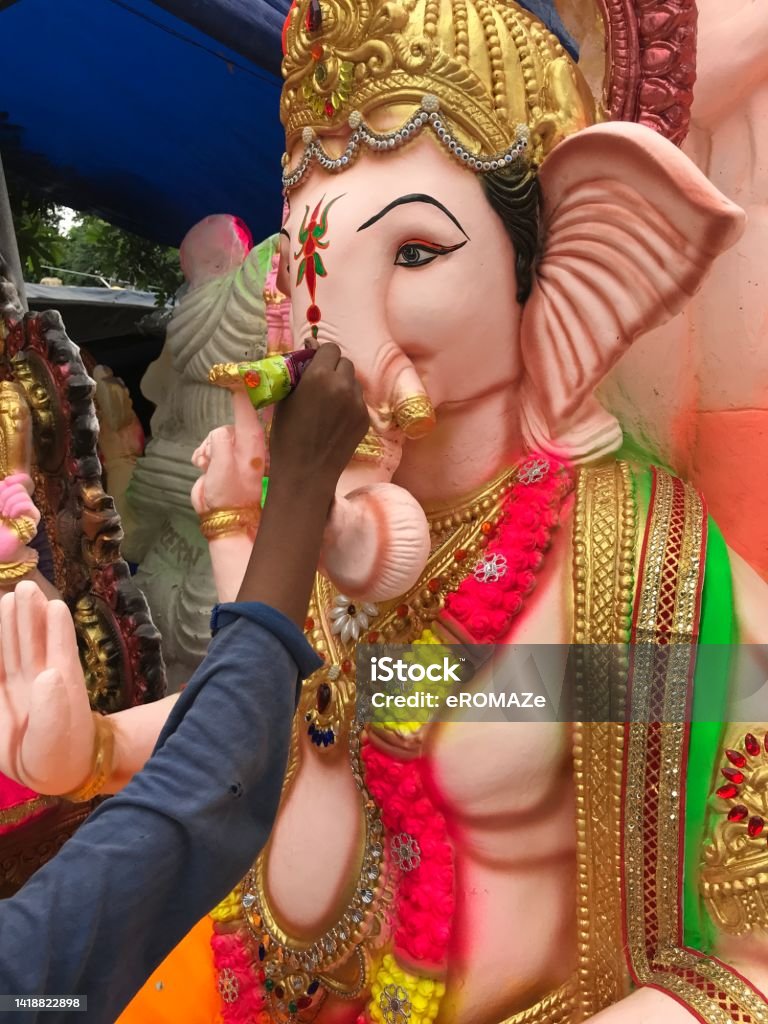 Colorful Lord Ganesha : Ganesh Chaturthi As the popular Indian festival of "Ganesha Chaturthi" approaches close, colorful idols of the popular Elephant God are put on sale in the market. These idols are bought for rendering home or community prayers in praise of Lord Ganesha. Ganesh Chaturthi Stock Photo