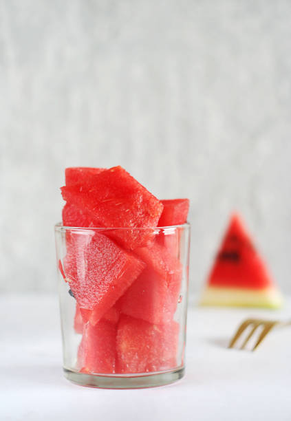 istock Watermelon slices lie in a transparent glass 1418822907