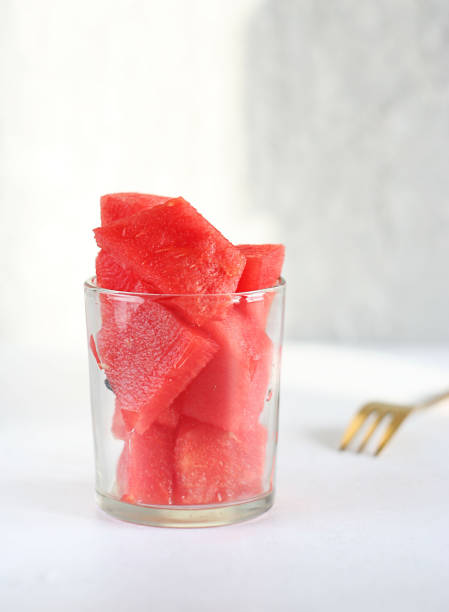 istock Watermelon slices lie in a transparent glass 1418822909
