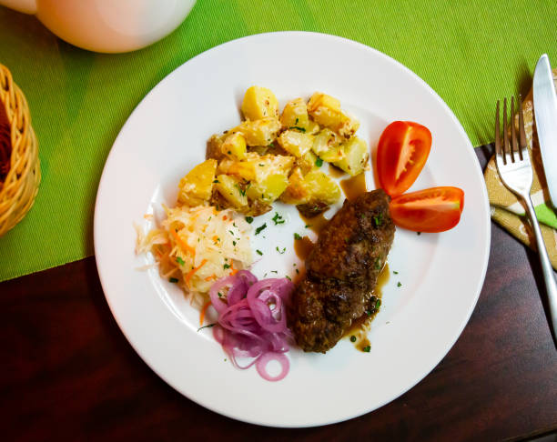 istock Plate with a meat dish lula-kebab and stewed potatoes. 1418823491