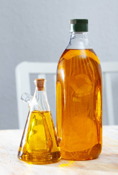 istock Vegetable oil on wooden table 1418823525