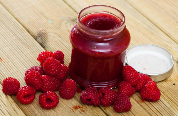istock Glass jar of raspberry jam 1418823548