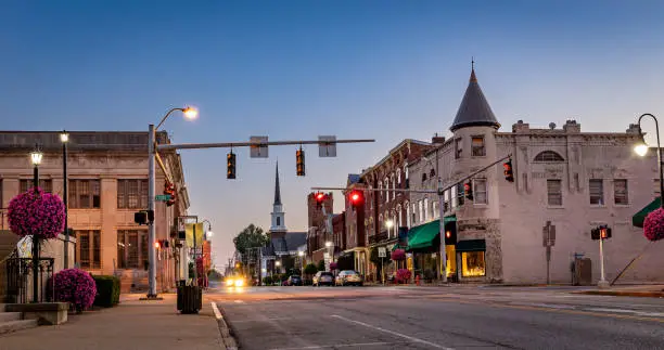 Scarce traffic on Main Street in downtown Woodford county's Versailles, KY during sunrise