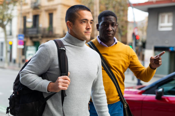 istock Men walking through city streets 1418827408