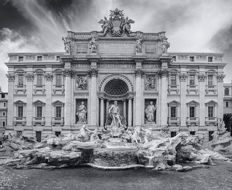 Italy, Rome. The Trevi Fountain (Italian: Fontana di Trevi) is an 18th-century fountain in the Trevi district in Rome, Italy, designed by Italian architect Nicola Salvi and completed by Giuseppe Pannini and several others.