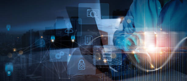 istock ERP, document management concept.Businessman working with smart phone and laptop computer with icons on virtual screen and city exposure background. 1418829191