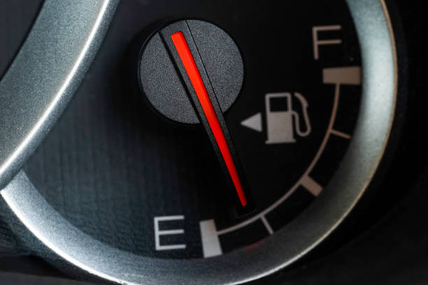 istock Low fuel gauge on car dashboard, close-up. 1418830602