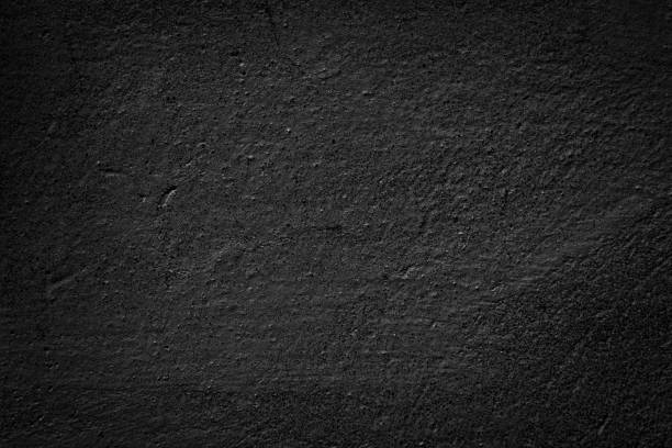 istock Dark grey black textured background. Black grunge cement wall texture for interior design. 1418832314