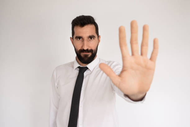 istock Attractive bearded man making stopping gesture 1418832341