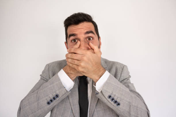 istock Bearded man closing mouth with palms 1418832351