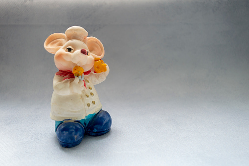 Charming assortment of Japanese maneki neko cats, featuring various colors, displayed on a wooden table, evoking luck and good fortune in japanese tradition and culture.