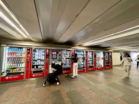 Rostov-on-Don, Russia - May 23, 2021: vending machine for soft drinks, coffee and snacks, massage chair in the waiting room of Platov International Airport