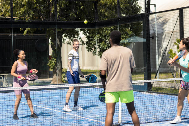 istock Group of four friends playing padel 1418835818