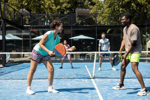istock Group of four friends playing padel 1418835895