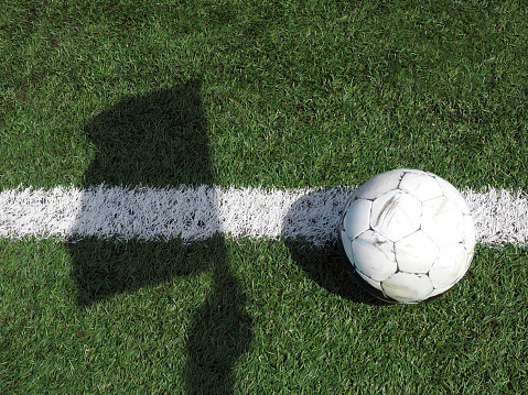 Soccer ball and flag shadow