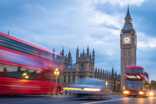 Traffic at Big Ben at the Blue Hour Red Double Decker Buses at Big Ben at Blue Hour in London double decker bus stock pictures, royalty-free photos & images