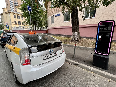 Moscow, Russia - August 26, 2022:  Electric Toyota Prius charging on Moscow street