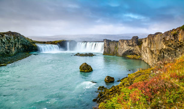 istock Fantastic panoramic view of powerful Godafoss waterfall. Dramatic sky over Godafoss. Location: Godafoss waterfall, Iceland, Europe. Artistic picture. Beauty world. Travel concept. 1418841542
