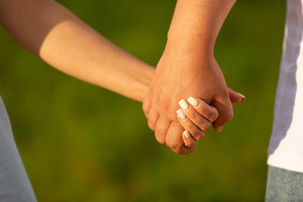 istock A man and a woman holding hands 1418843689
