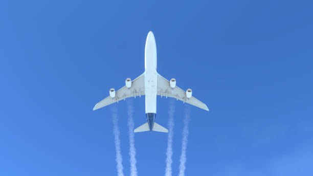 istock Commercial aircraft flying over the blue sky 1418845508