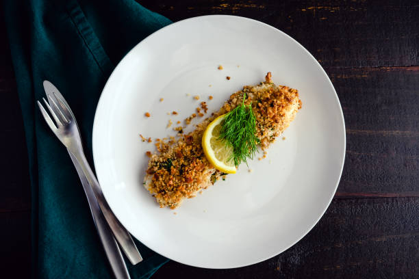 istock Walnut-Crusted Halibut in Lemon Wine Sauce Viewed from Above 1418845623