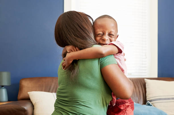 istock Cute little boy hugging his mother 1418850303