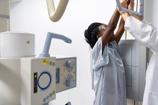 Young woman undergoing a full xray scan