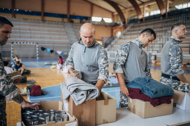 istock Soldiers preparing donations for civilians 1418850552
