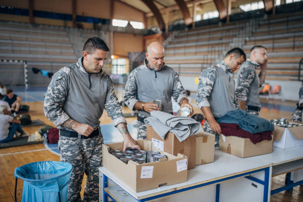 istock Soldiers preparing donations for civilians 1418850577