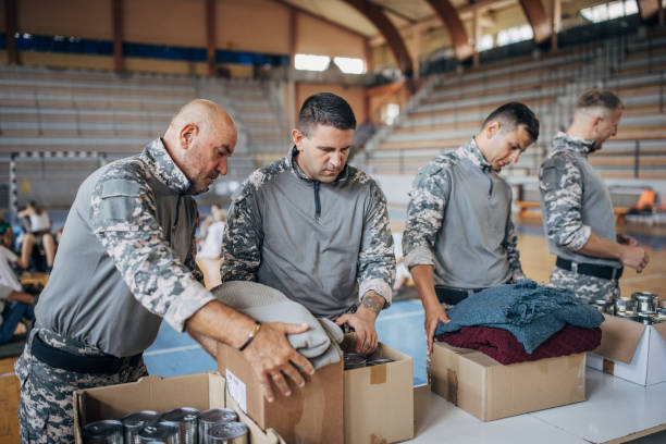 istock Soldiers preparing donations for civilians 1418850599