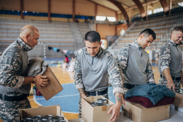 istock Soldiers preparing donations for civilians 1418850619