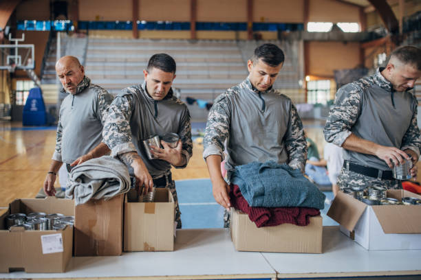 istock Soldiers preparing donations for civilians 1418850632
