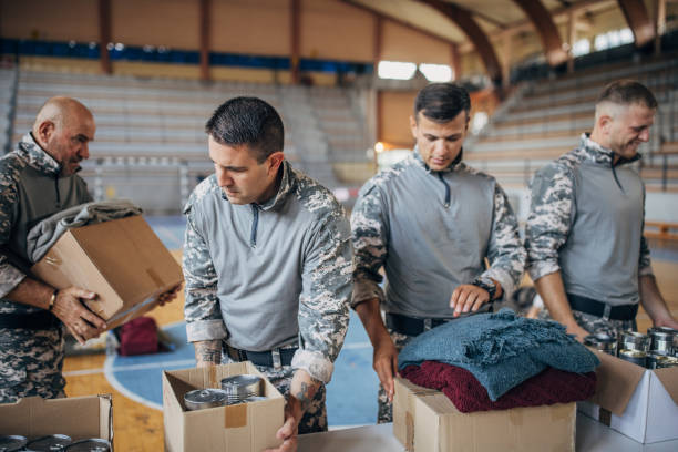 istock Soldiers preparing donations for civilians 1418850643