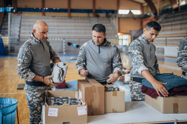 istock Soldiers preparing donations for civilians 1418850656