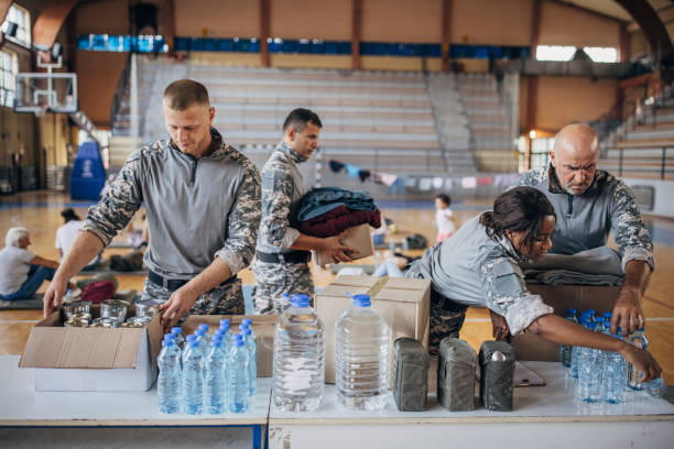 istock Soldiers preparing donations for civilians 1418851272