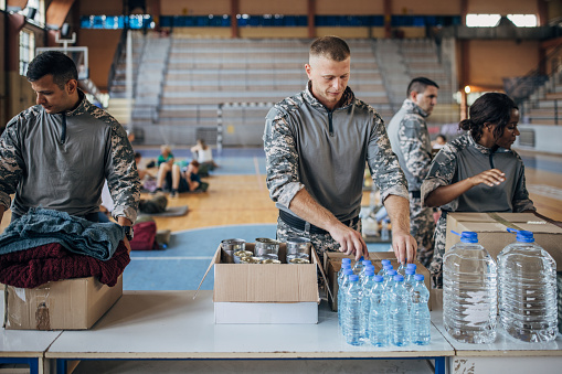 Soldiers preparing donations for civilians