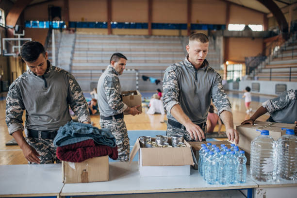 istock Soldiers preparing donations for civilians 1418851296