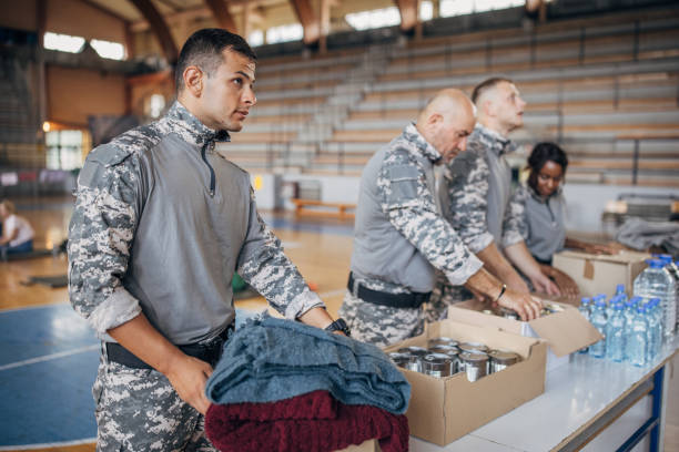 istock Soldiers preparing donations for civilians 1418851422