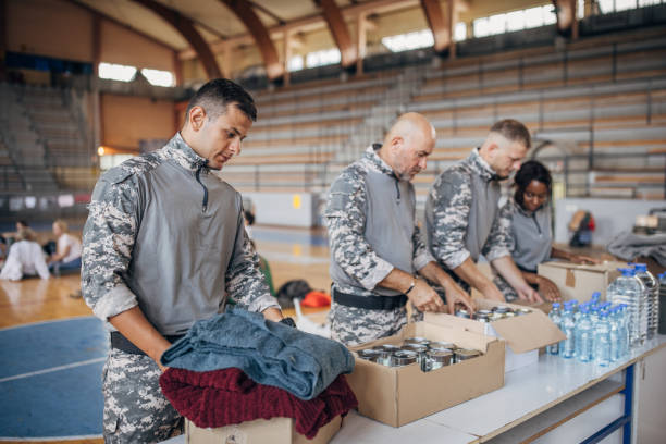 istock Soldiers preparing donations for civilians 1418851501