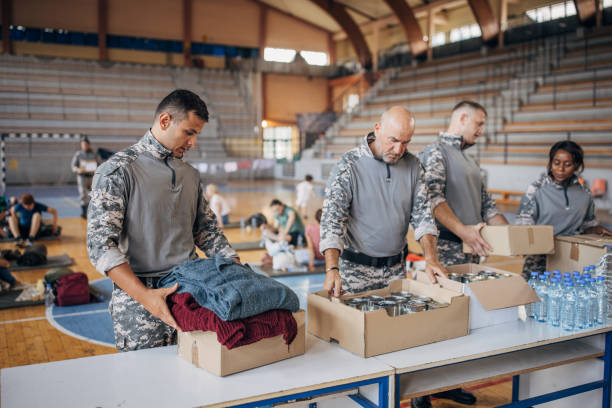 istock Soldiers preparing donations for civilians 1418851526