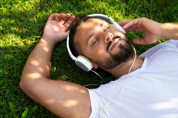 istock Relaxed man listening to music 1418853465