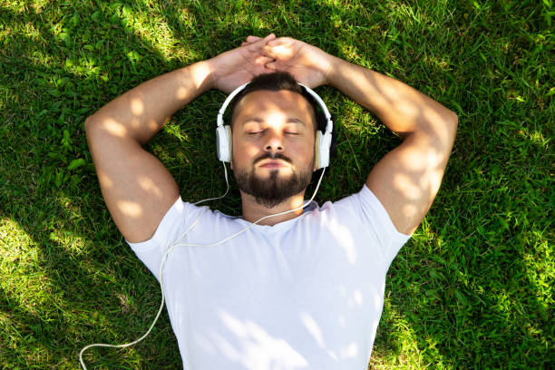 istock Relaxed man listening to music 1418853483