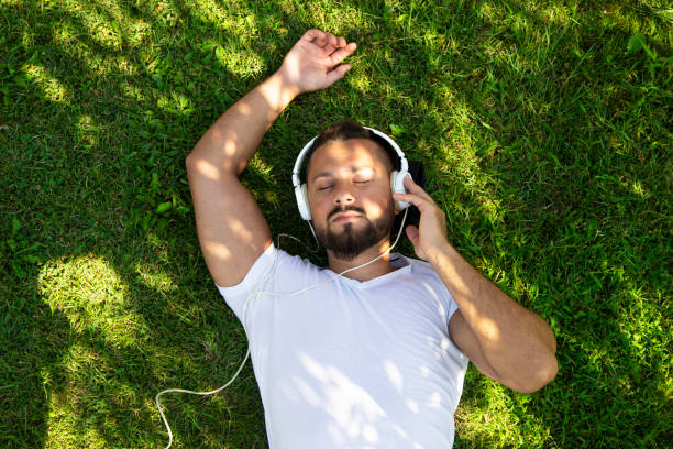 istock Relaxed man listening to music 1418853506