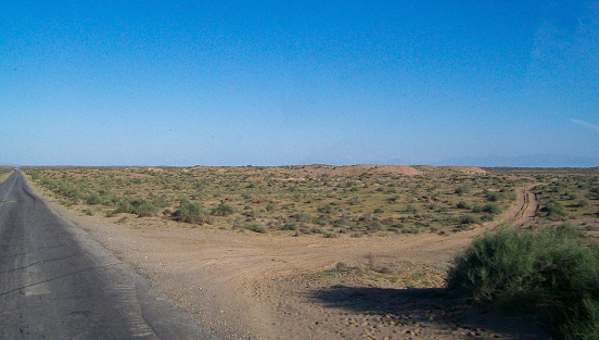 a photo of uzbek road nature in the countryside of termez and federal army vehicles