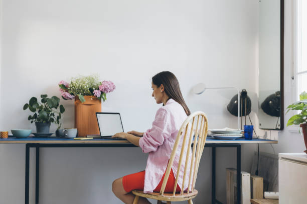 istock A Serious Beautiful Businesswoman Typing On Her Computer While Working From Home 1418854727