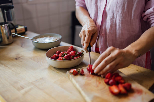 An Unrecognizable Woman Preparing Some Healthy Meal With Cereals And Fruit