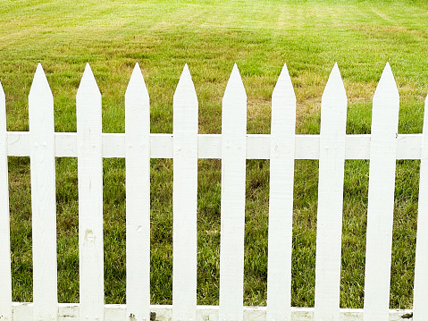 White Picket fence with grassy backdrop