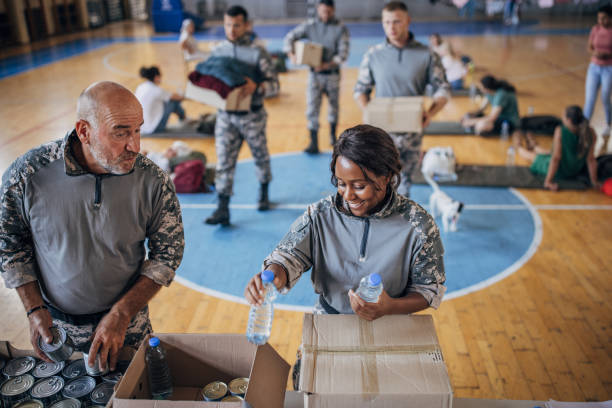 istock Soldiers preparing donations for civilians 1418856242